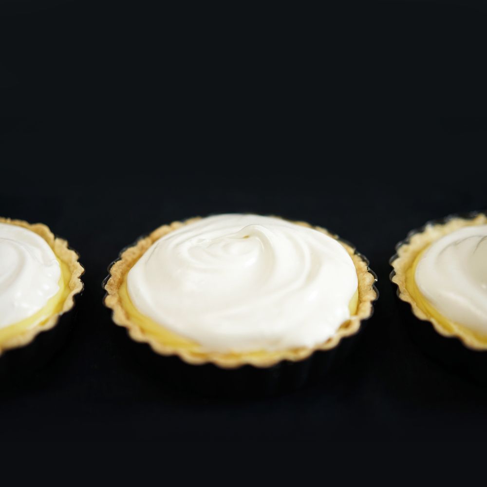 Rezeptbild: Limetten-Kokos-Tartelettes mit Baiser