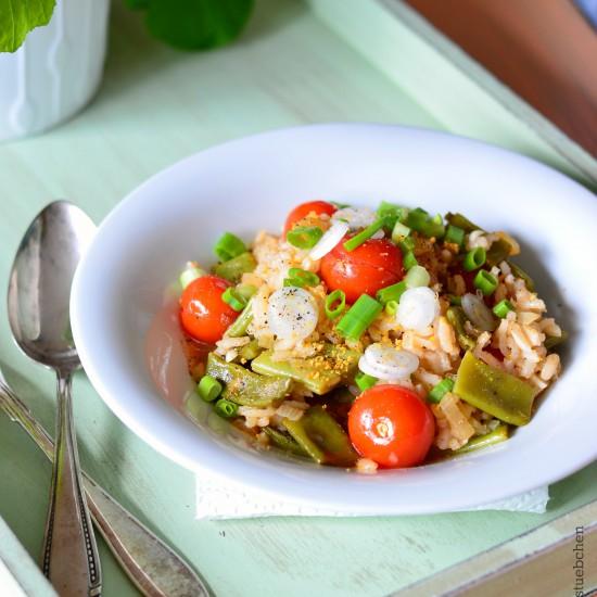Rezeptbild: Paella mit Kirschtomaten, Bohnen und Lauchzwiebeln
