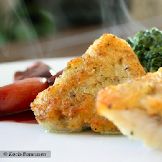 Rezeptbild: Rotbarsch mit Thymian-Kartoffelkruste und süßen Rotwein-Schalotten